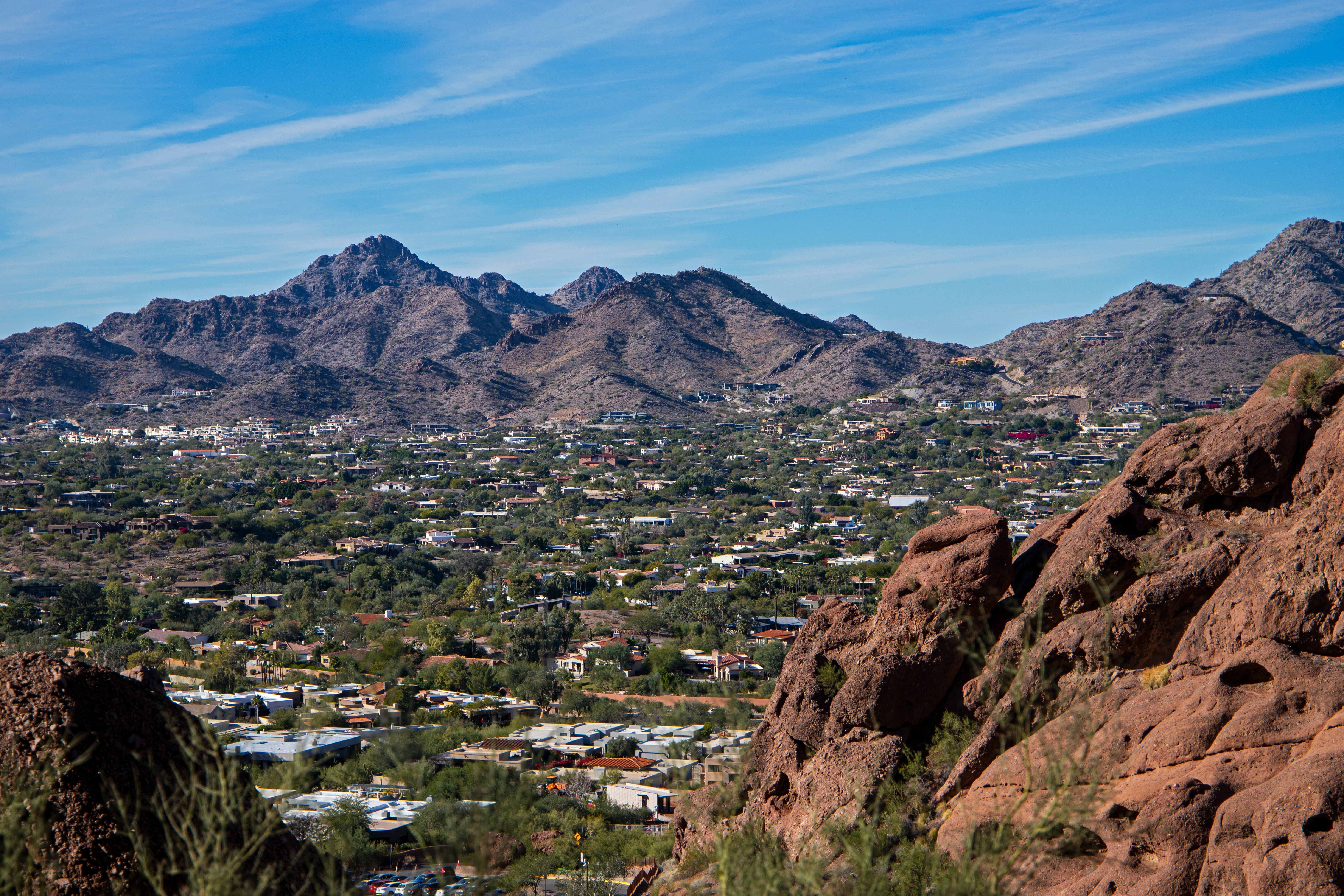 Aerial view of Phoenix-area neighborhoods and mountains